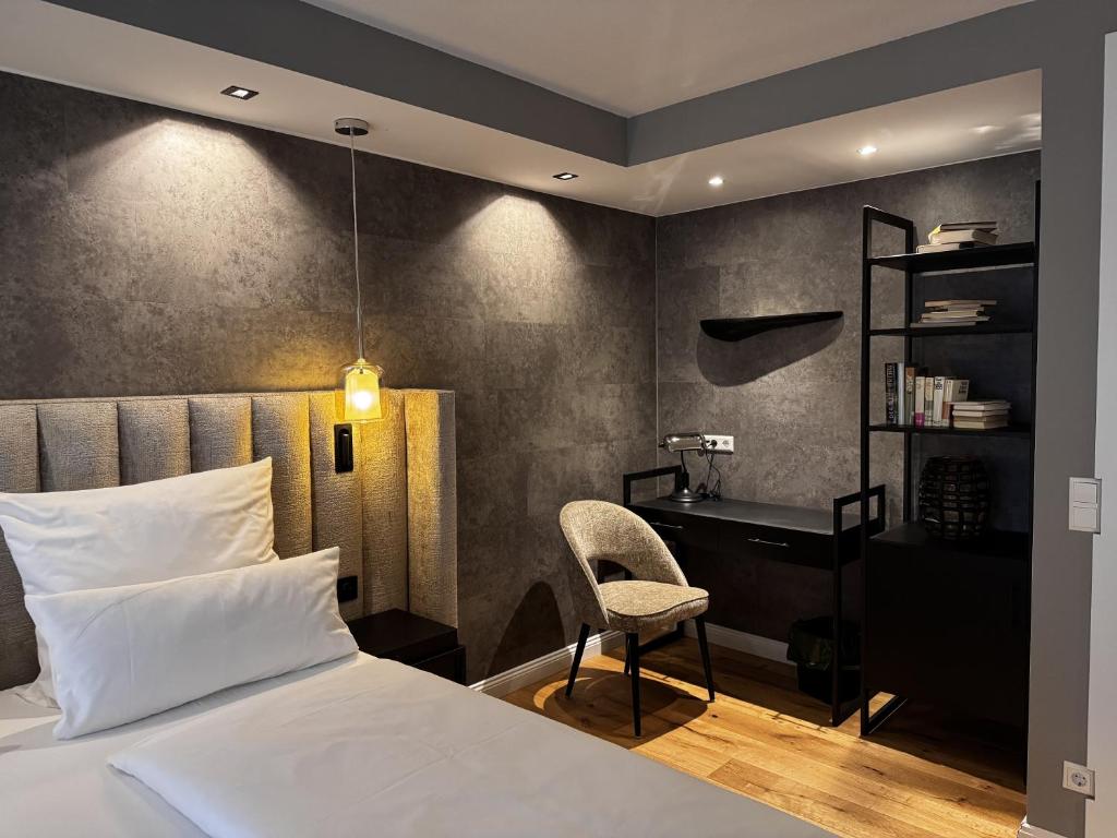 Postel nebo postele na pokoji v ubytování Hotel Luisenpark