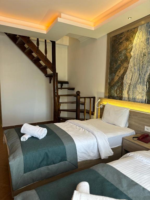 Postel nebo postele na pokoji v ubytování The Kumsal Hotel Oludeniz
