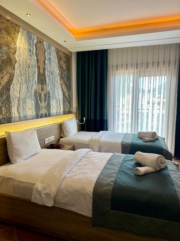 Postel nebo postele na pokoji v ubytování The Kumsal Hotel Oludeniz