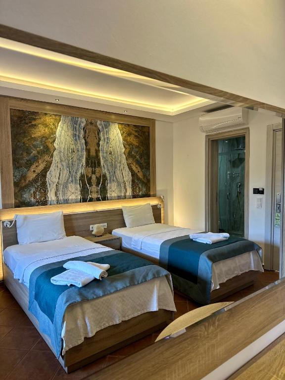 Postel nebo postele na pokoji v ubytování The Kumsal Hotel Oludeniz