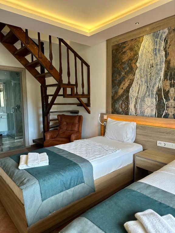 Postel nebo postele na pokoji v ubytování The Kumsal Hotel Oludeniz