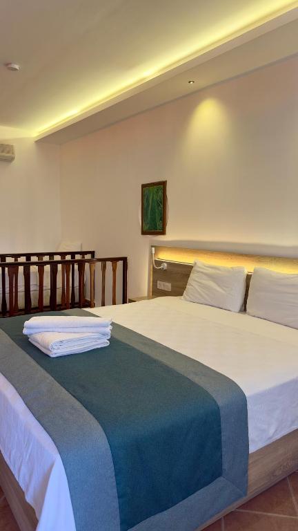 Postel nebo postele na pokoji v ubytování The Kumsal Hotel Oludeniz