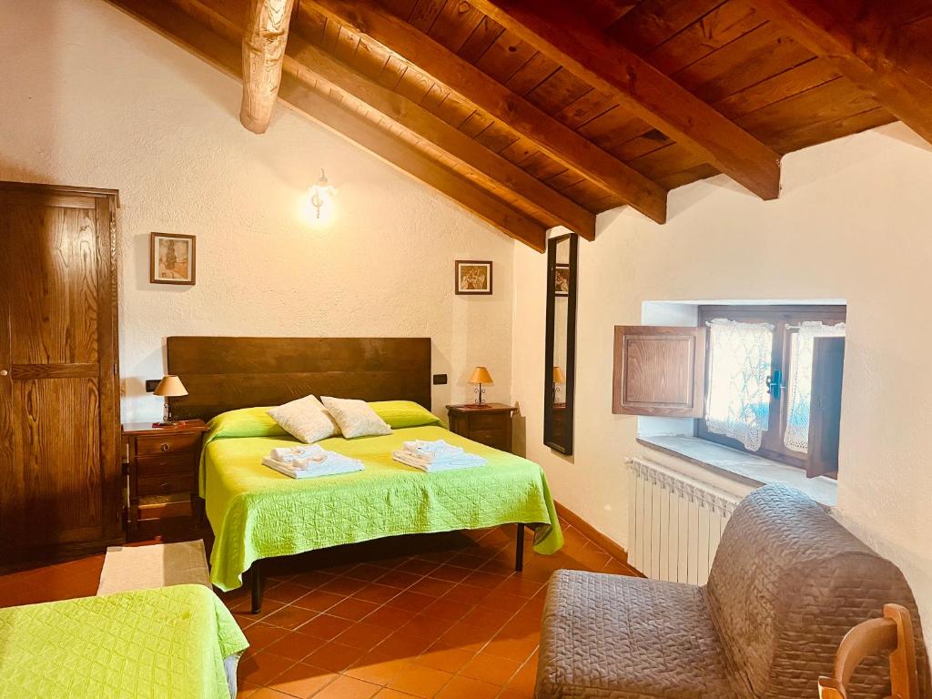 A bed or beds in a room at Agriturismo Montagna Verde Apella