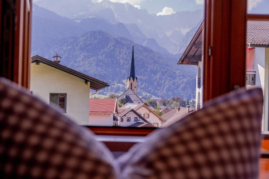 a view from a window of a town with a church at Ferienwohnung Wiagsog in Garmisch-Partenkirchen