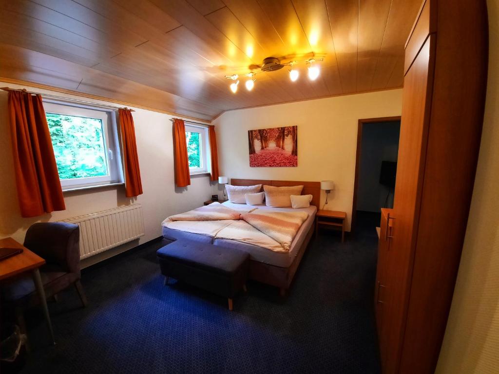 Postel nebo postele na pokoji v ubytování Café- Pension Fernblick, incl MeineCardPlus