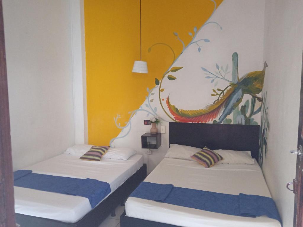 Postel nebo postele na pokoji v ubytování Casona Don Juan Hostel