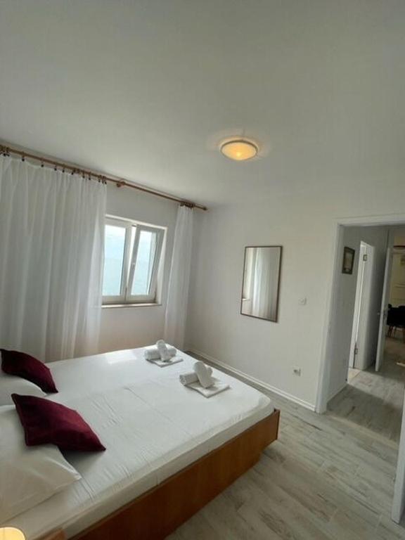 Posteľ alebo postele v izbe v ubytovaní Apartments Sea View