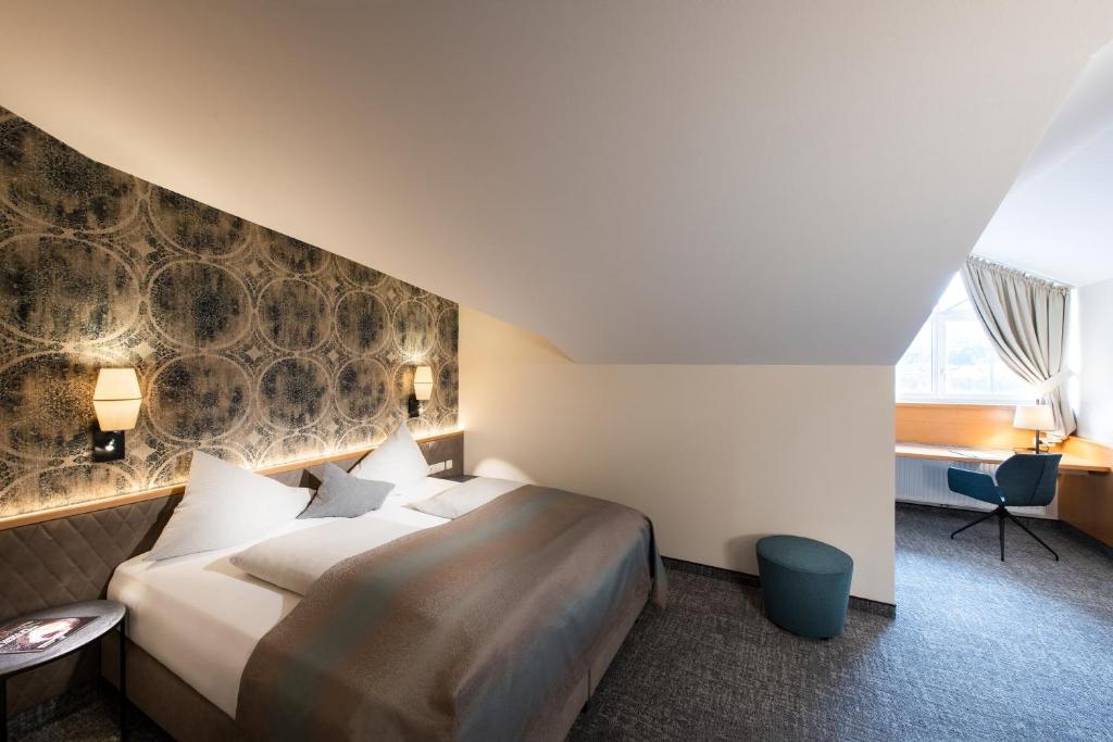 Postel nebo postele na pokoji v ubytování Hotel Königgut