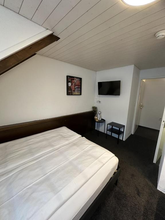 Postel nebo postele na pokoji v ubytování Hotel Baslertor