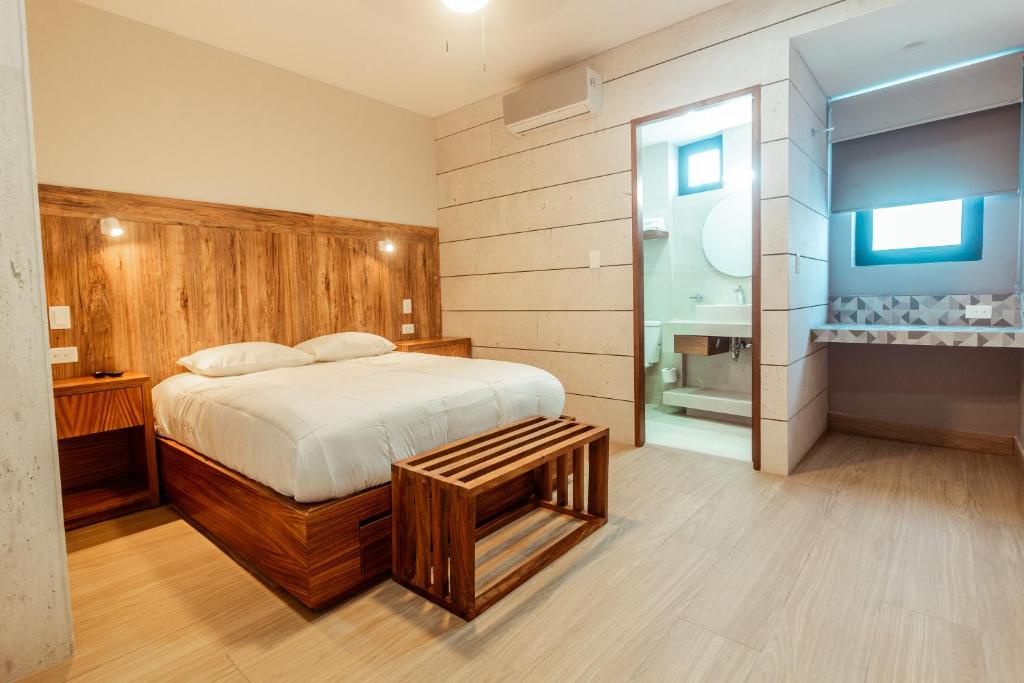 Postel nebo postele na pokoji v ubytování Xoza Hotel Urban Escape