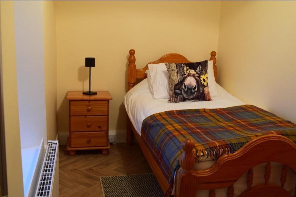 Postel nebo postele na pokoji v ubytování Heather Cottage Doolin