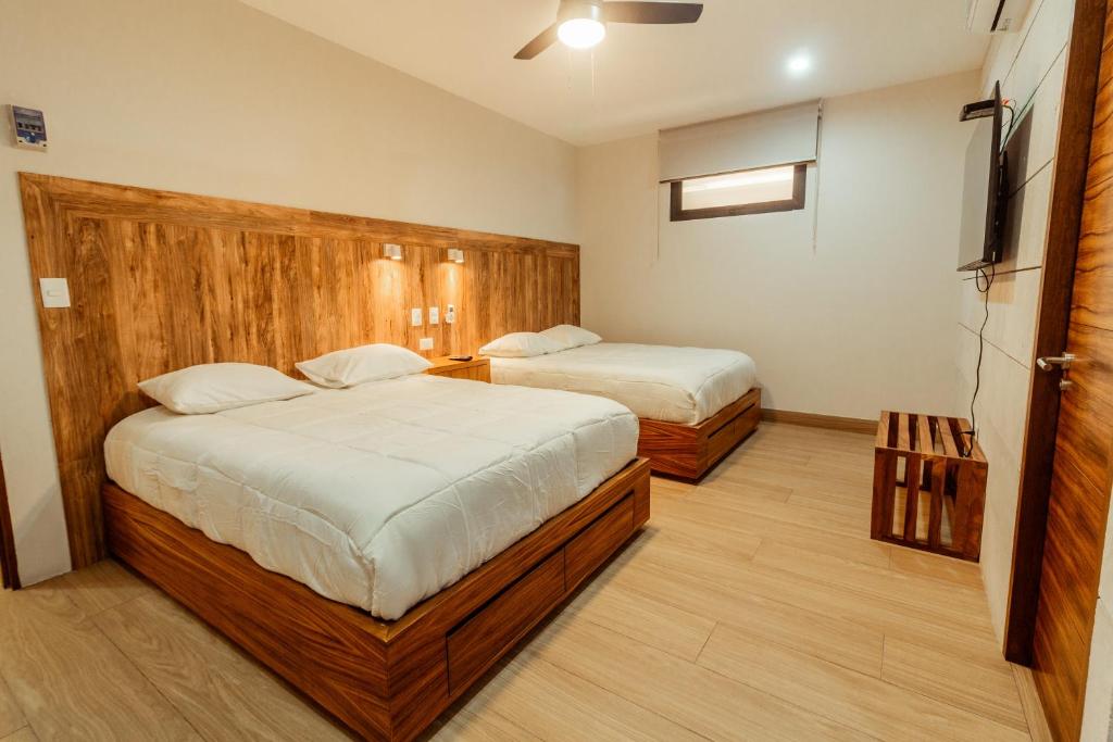 Postel nebo postele na pokoji v ubytování Xoza Hotel Urban Escape