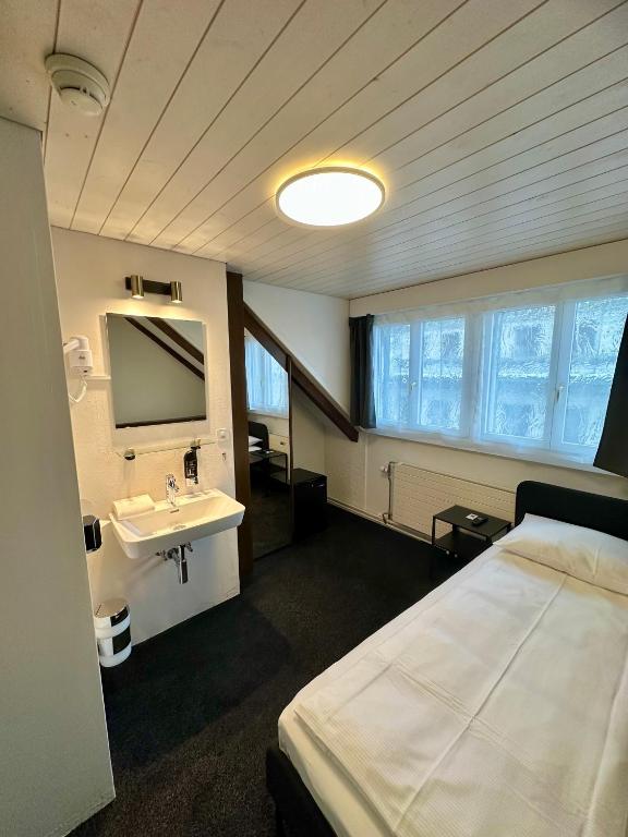 Postel nebo postele na pokoji v ubytování Hotel Baslertor