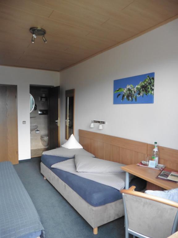 Postel nebo postele na pokoji v ubytování Café- Pension Fernblick, incl MeineCardPlus