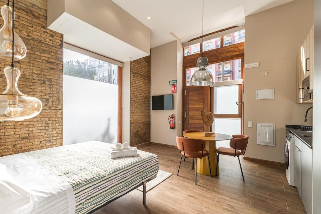 Μια τηλεόραση ή/και κέντρο ψυχαγωγίας στο Suite Premium junto al Río Turia 1