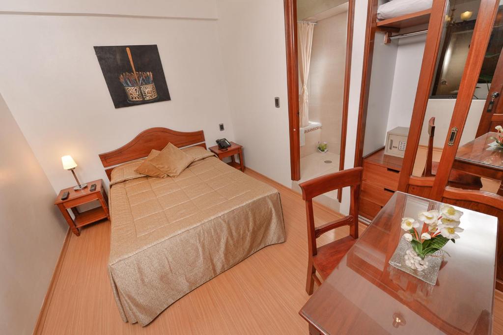 Postel nebo postele na pokoji v ubytování Hotel Ruinas