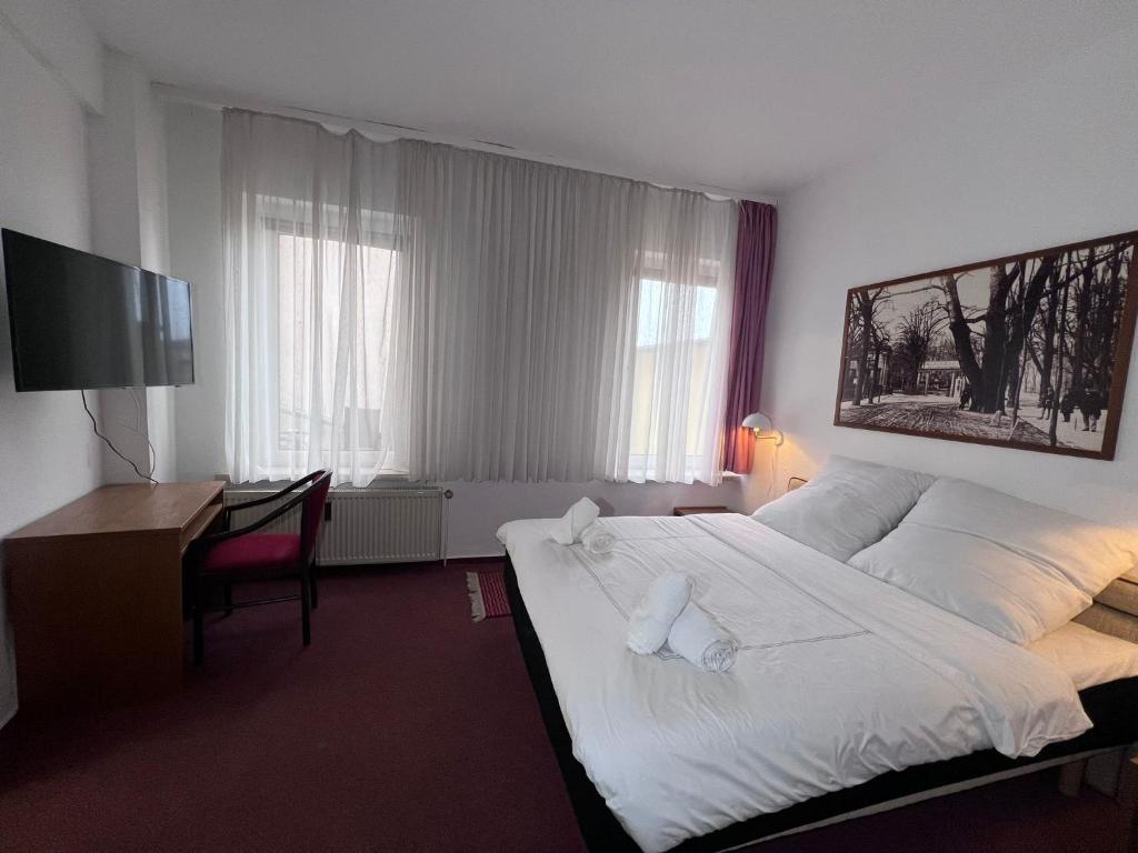 Postel nebo postele na pokoji v ubytování Hotel Doko Gardelegen