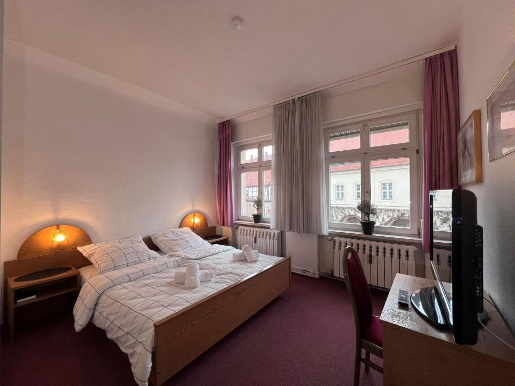 Postel nebo postele na pokoji v ubytování Hotel Doko Gardelegen