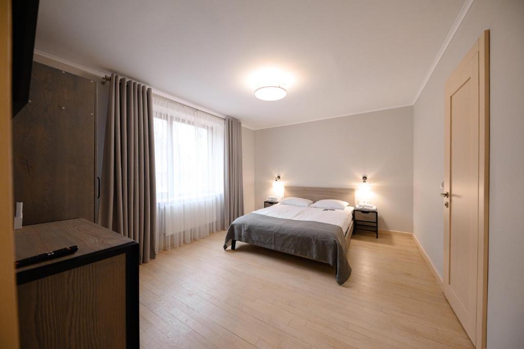 Postel nebo postele na pokoji v ubytování Voevodyno Resort