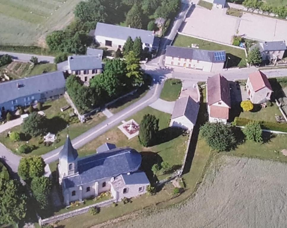 an aerial view of a small town with a church at Maison de vacances ou chambres d'hôtes belle campagne auvergnate in Saint-Julien-la-Geneste