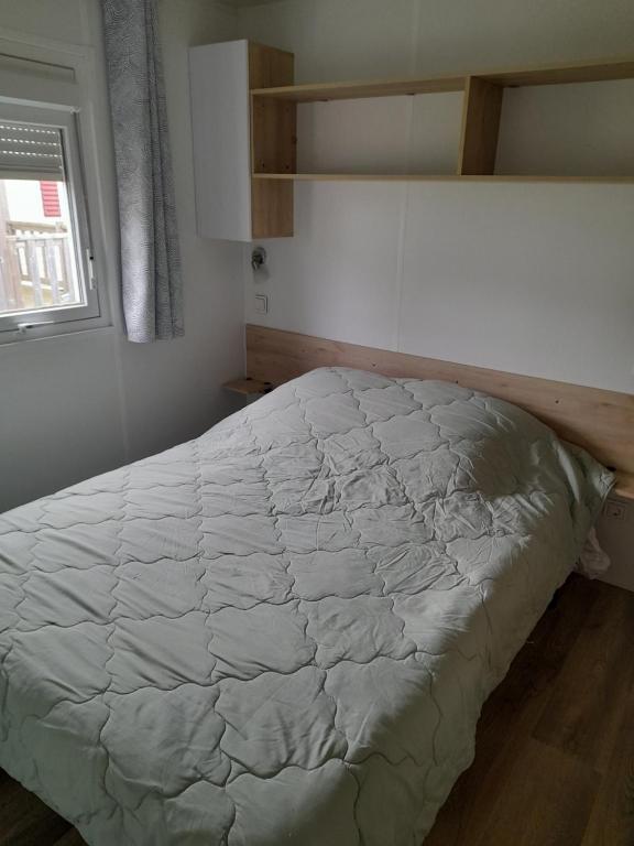 Postel nebo postele na pokoji v ubytování Mobil home