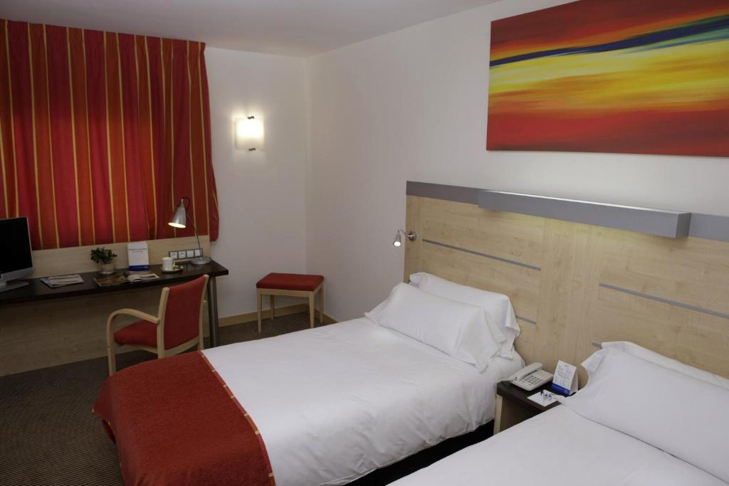 Postel nebo postele na pokoji v ubytování Holiday Inn Express Málaga Airport by IHG