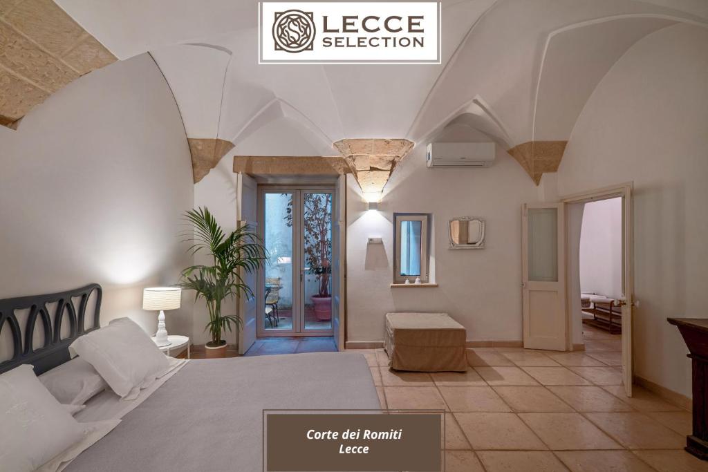 A bed or beds in a room at Corte dei Romiti Apartment - Lecce Selection