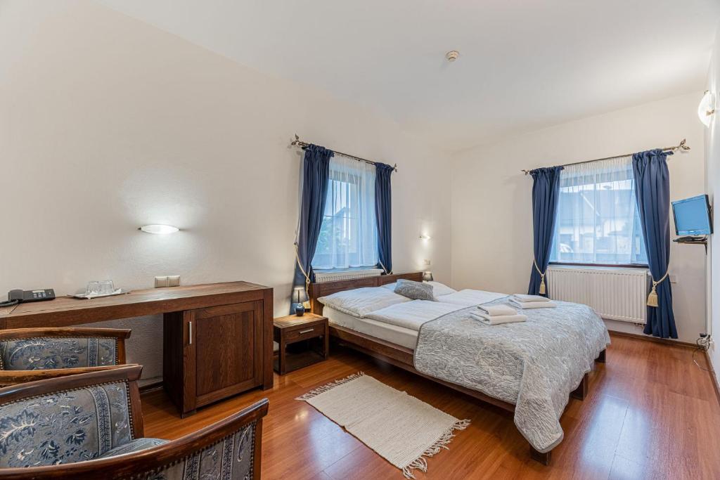 Postel nebo postele na pokoji v ubytování Hotel Amalia