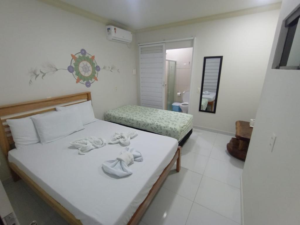 Postel nebo postele na pokoji v ubytování Mandala Hostel Maragogi Oficial