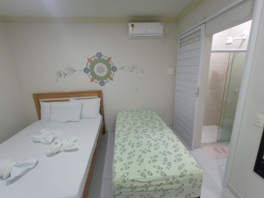 Postel nebo postele na pokoji v ubytování Mandala Hostel Maragogi Oficial