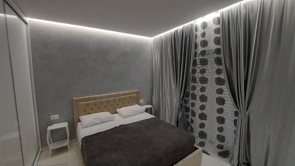 Ένα ή περισσότερα κρεβάτια σε δωμάτιο στο Beni 's apartments