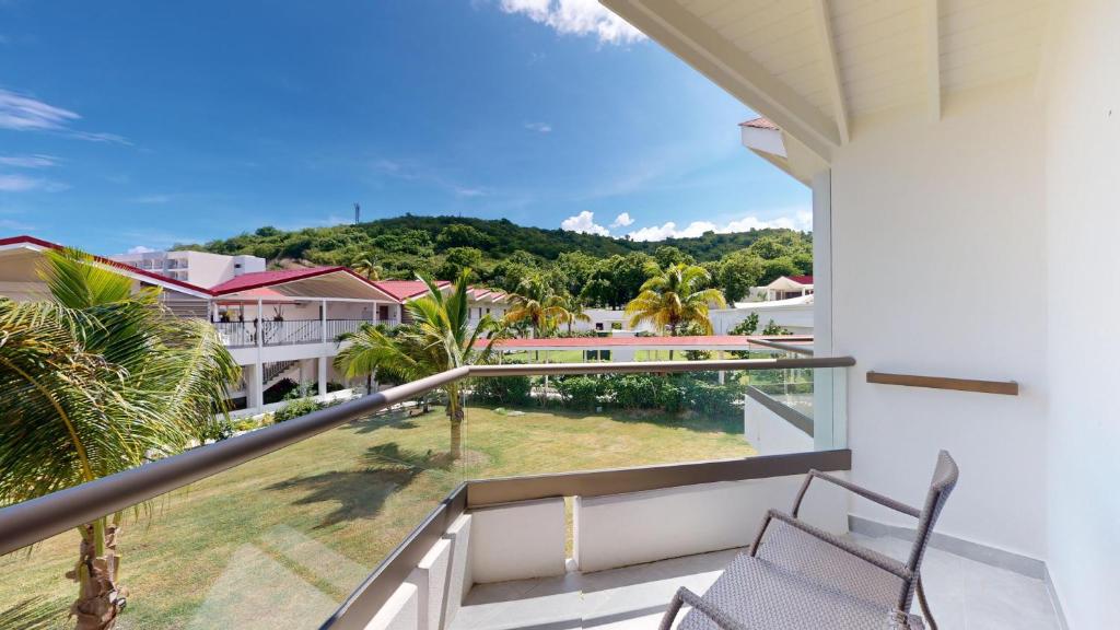 a balcony with a view of a resort at Royalton CHIC Antigua, An Autograph Collection All-Inclusive Resort - Adults Only in Saint Johnʼs