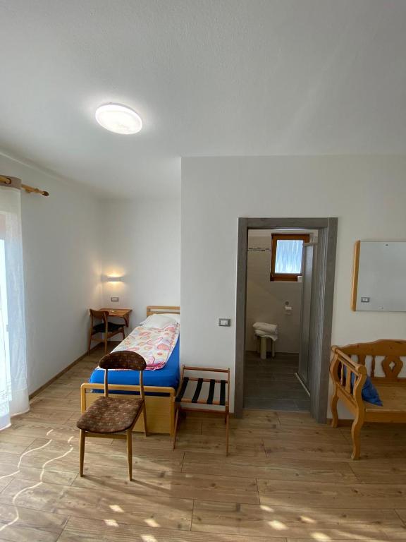 Postel nebo postele na pokoji v ubytování Hotel Camoscio