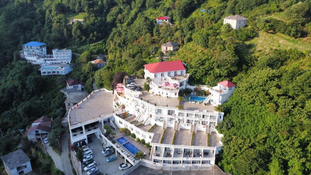 an aerial view of a large house on a mountain at Zura palace in Kvariati