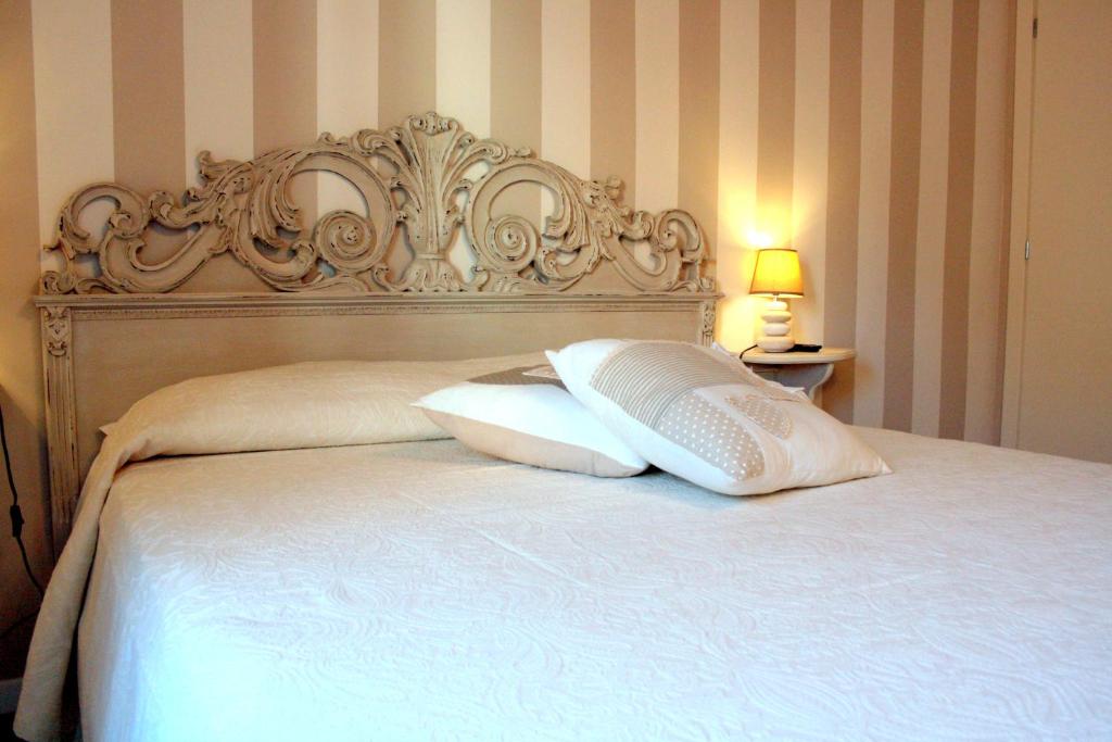 A bed or beds in a room at Terrazza Biennale