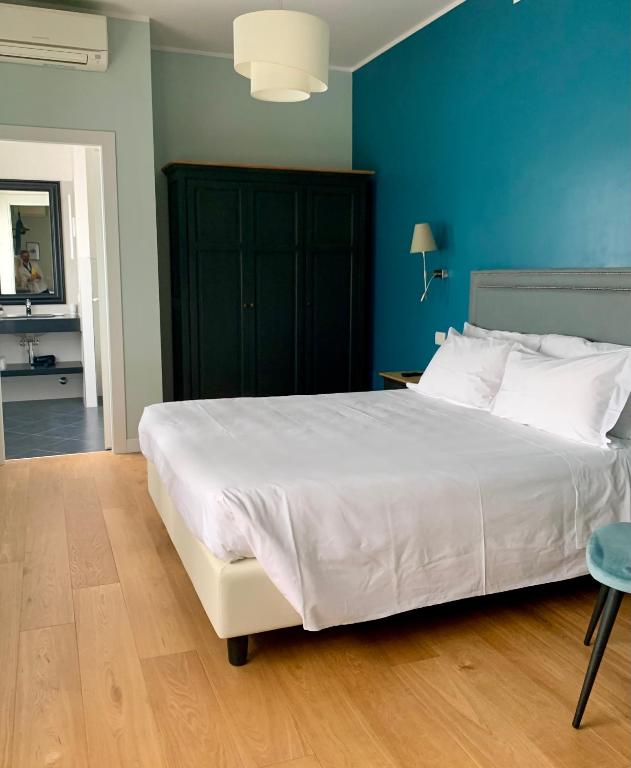 Postel nebo postele na pokoji v ubytování Hotel Fenix
