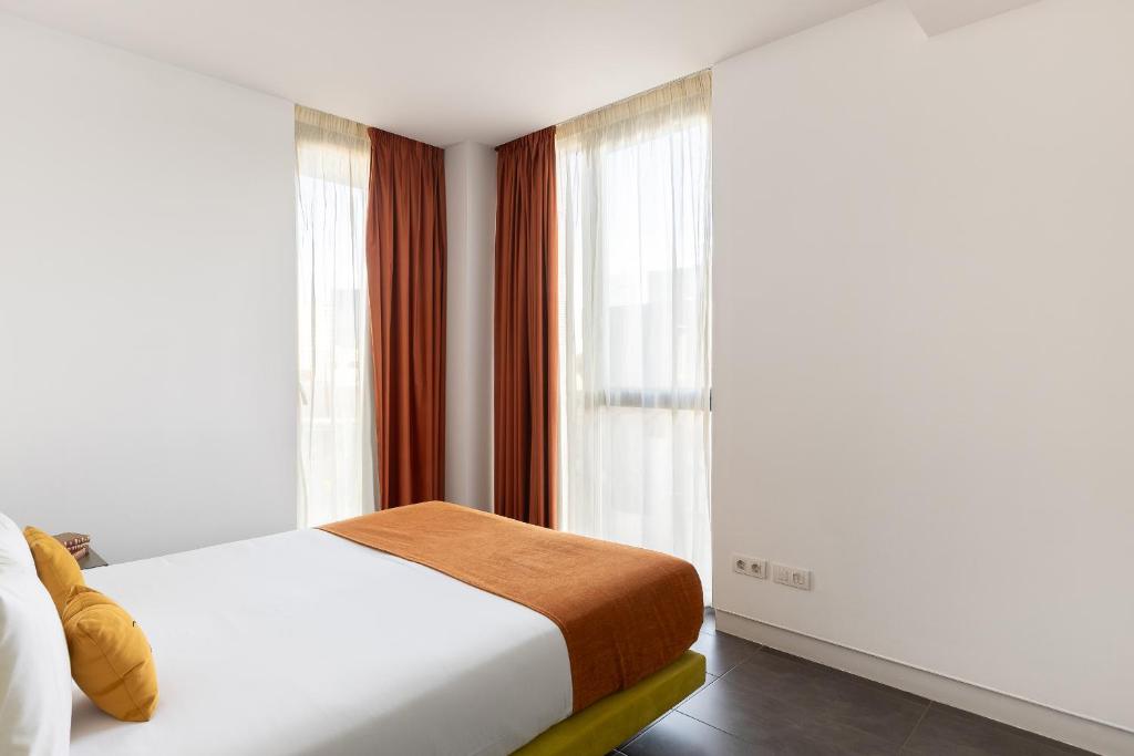 Posteľ alebo postele v izbe v ubytovaní Cosmo Apartments Sants