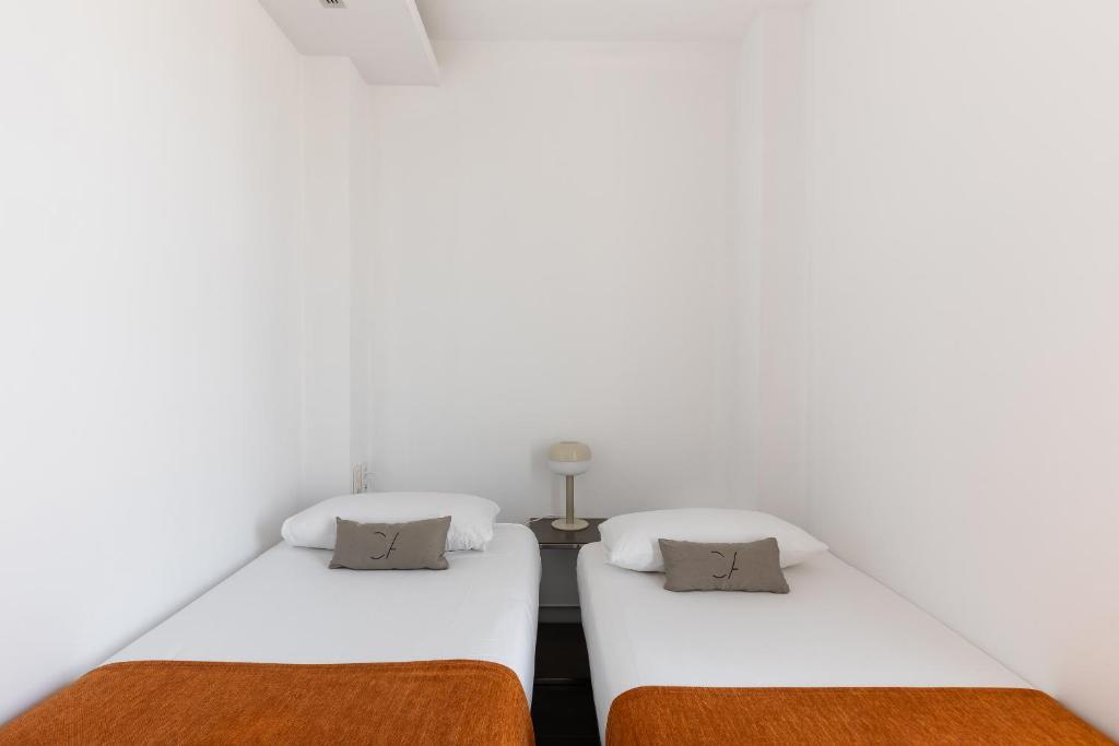 Posteľ alebo postele v izbe v ubytovaní Cosmo Apartments Sants