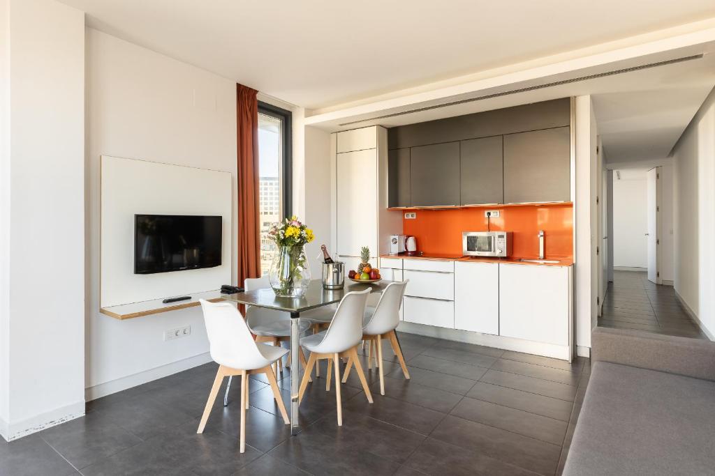 Kuchyňa alebo kuchynka v ubytovaní Cosmo Apartments Sants
