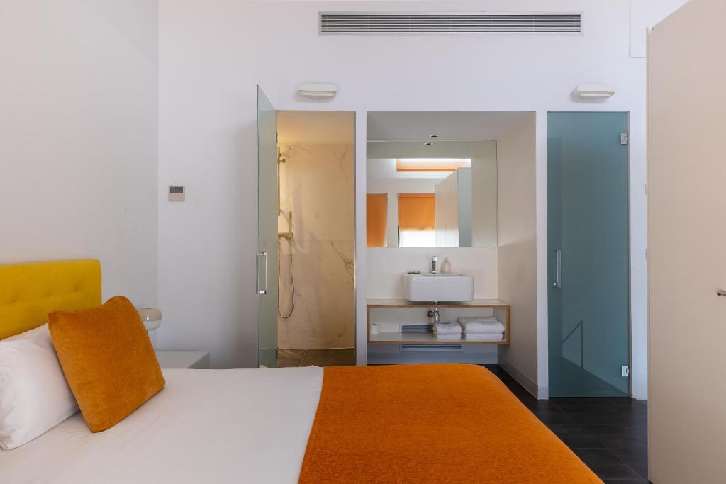 Posteľ alebo postele v izbe v ubytovaní Cosmo Apartments Sants
