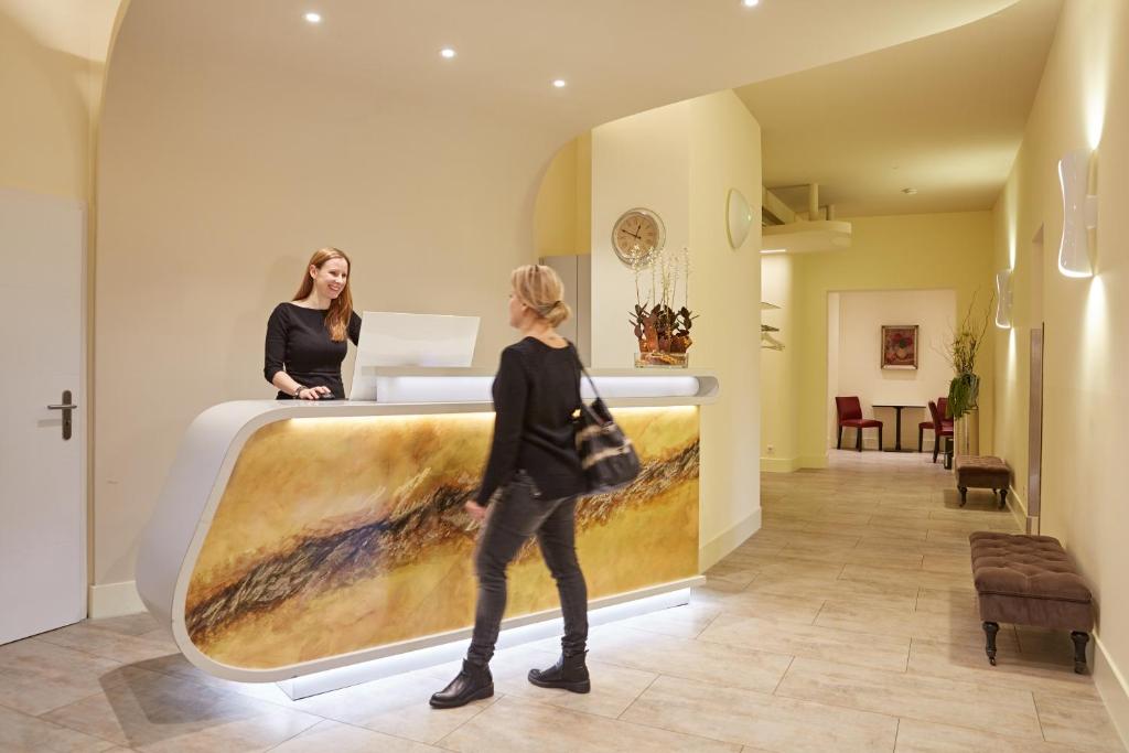 Postel nebo postele na pokoji v ubytování Hotel Prinzregent