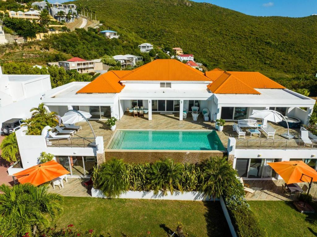 an aerial view of a house with a swimming pool at VILLADO LUXURY - sint marteen in Dawn Beach