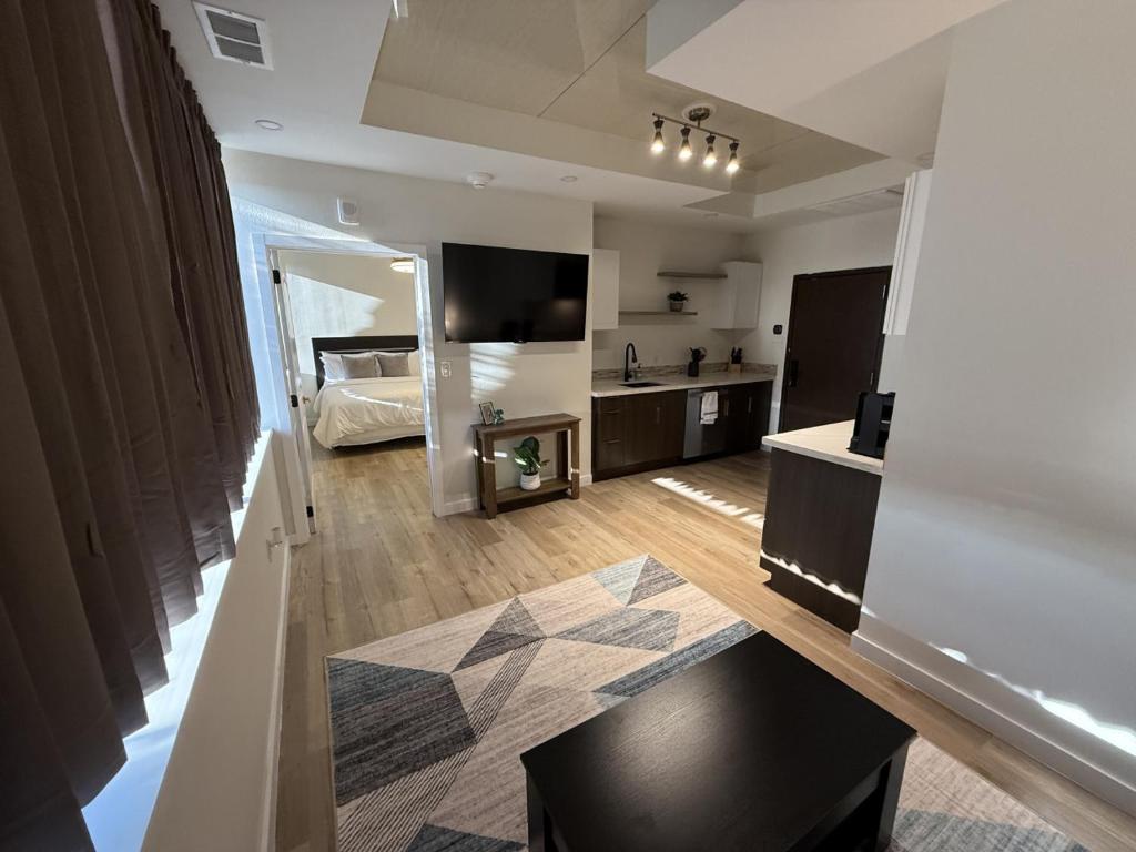 a large room with a bed and a table in it at 1 - Serenity Suite - 1 - Reese Tower in Tulsa