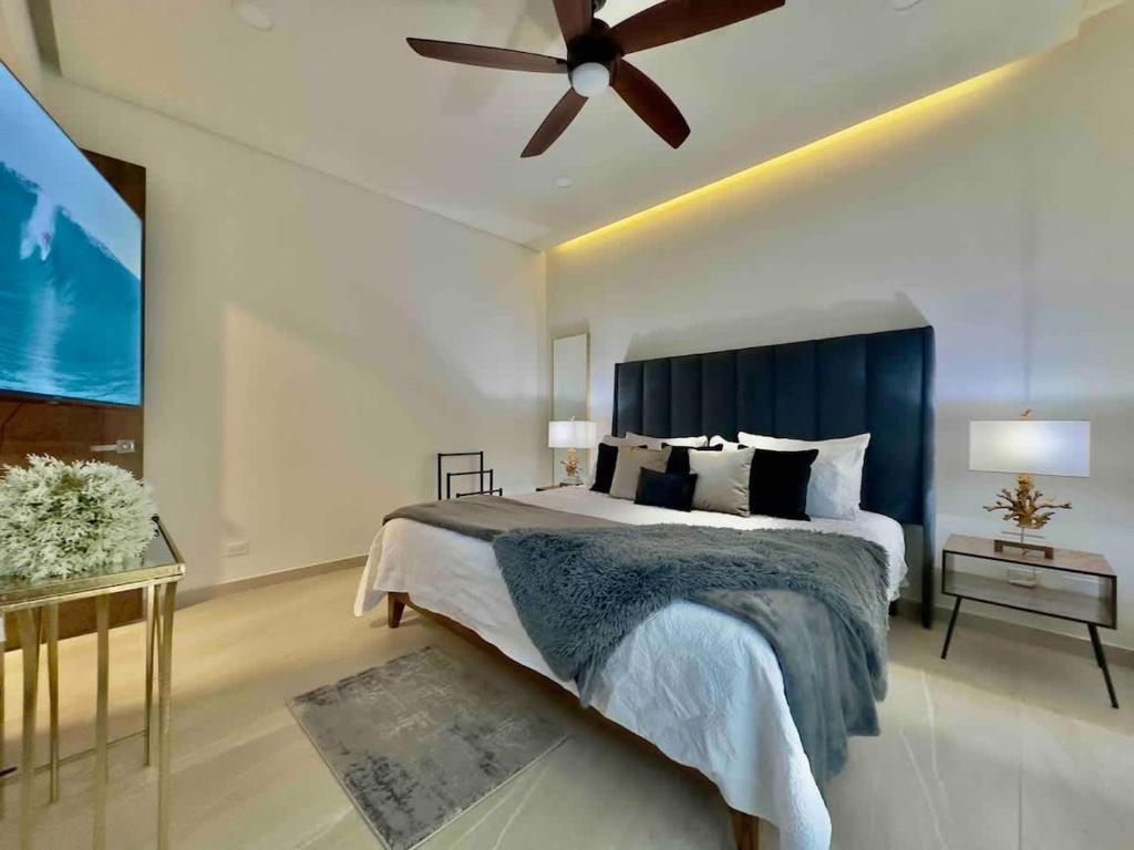 a bedroom with a bed and a ceiling fan at Rosarito Misión Viejo Sur in La Bloquera