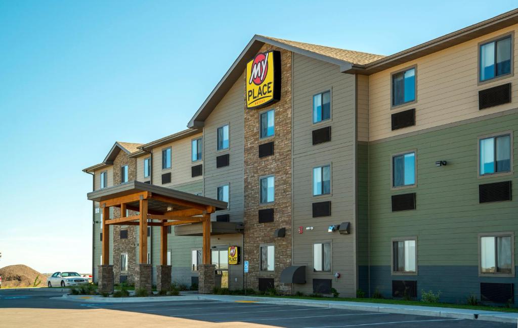 a hotel building with a for sale sign on it at My Place Hotel Rapid City in Rapid City