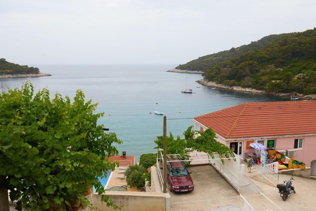 a view of a body of water from a building at Apartments Jany in Saplunara