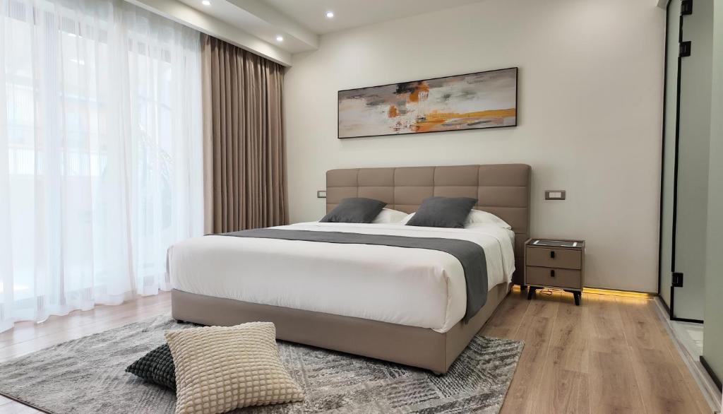 Postel nebo postele na pokoji v ubytování CC LUX Suites