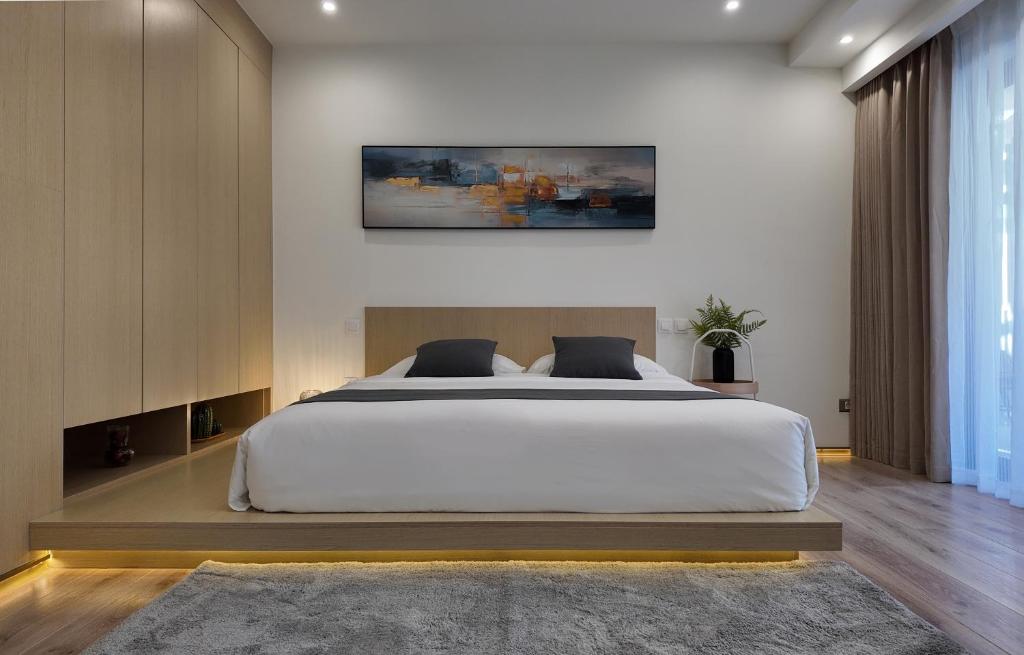 Postel nebo postele na pokoji v ubytování CC LUX Suites