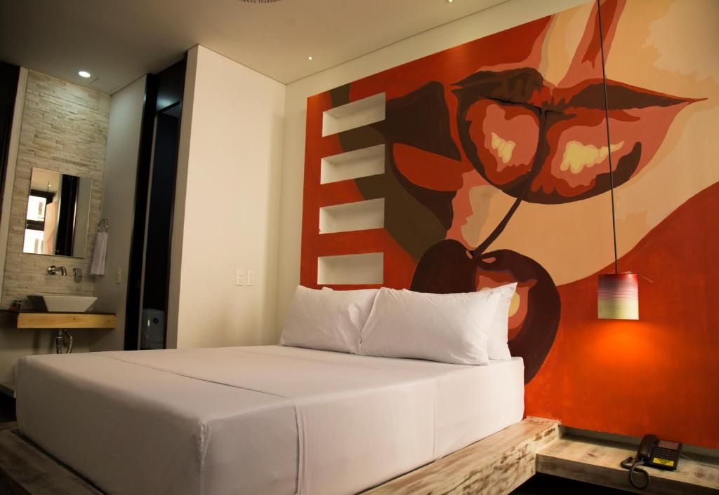 Postel nebo postele na pokoji v ubytování Graffity Hotel Med