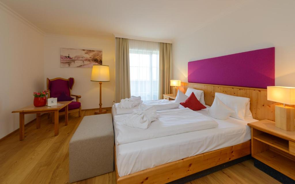 Postel nebo postele na pokoji v ubytování Hotel Walserwirt